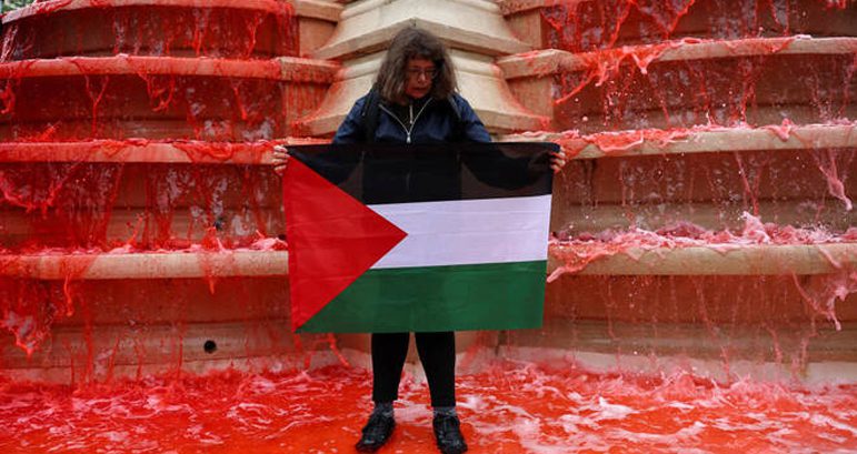 Paris fountain turned red to symbolize massacre in Palestine